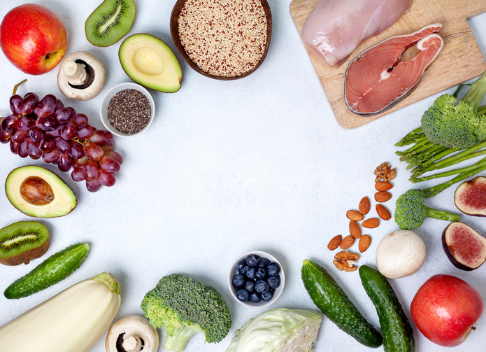 holistic nutritionist: table full of vegetables, fruit, meats, nuts and seeds
